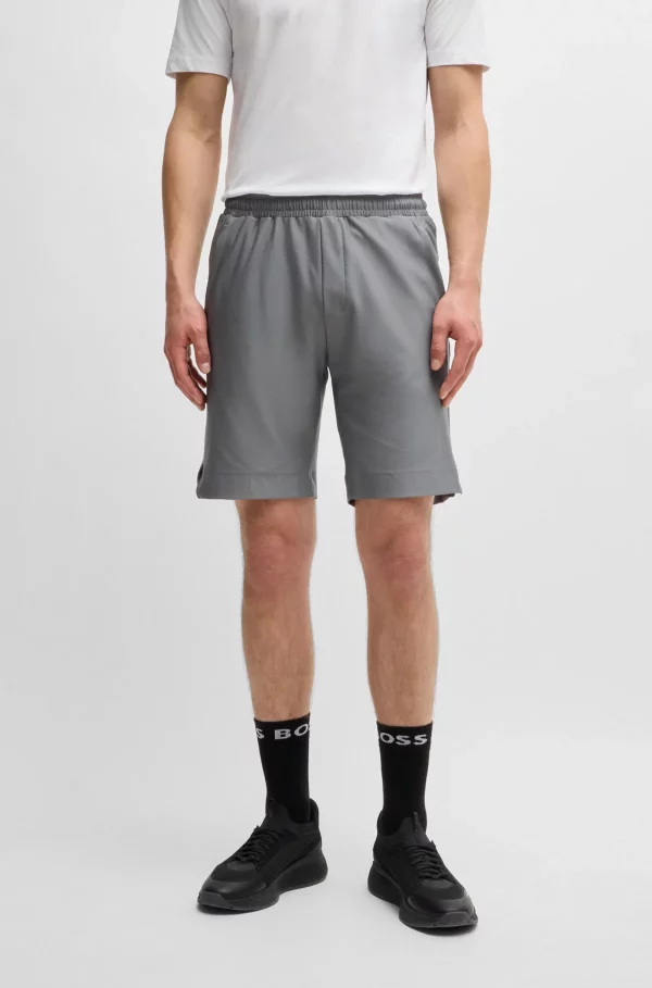 Quick-dry shorts with decorative reflective logo